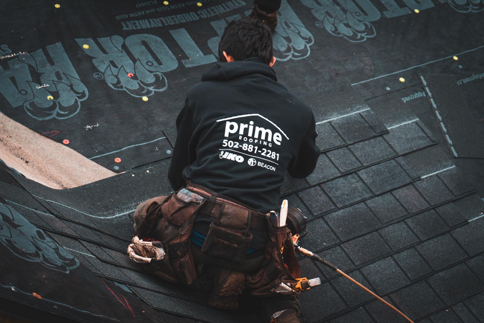 Prime Roofing crew performing roof maintenance